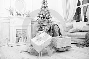 Cute little children girl with xmas present. happy little girls sisters celebrate winter holiday. christmas time. happy