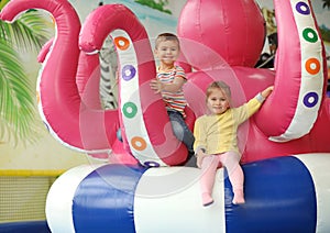 Cute little children playing at amusement park
