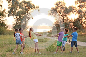 Cute little children playing outdoors