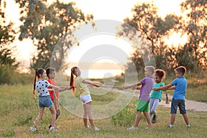 Cute little children playing outdoors photo