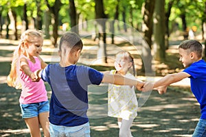 Cute little children playing in park