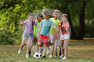 Cute little children playing with soccer ball