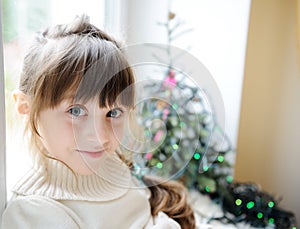 Cute little girl in anticipation of the holiday photo