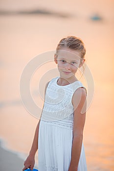 Cute little girl at beach during caribbean vacation