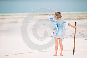 Cute little girl at beach during caribbean vacation