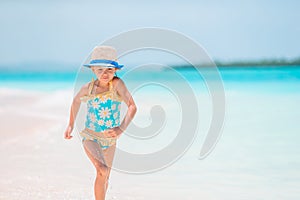 Cute little girl at beach during caribbean vacation