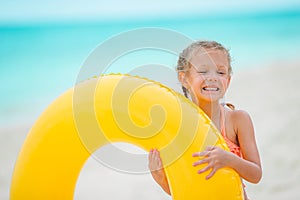 Cute little girl at beach during caribbean vacation