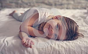 Cute little girl in bed.