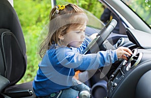 Cute little girl behind wheel