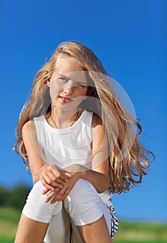 Cute little girl with blond long hair