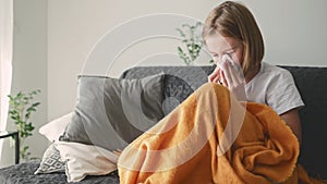 Cute little girl blowing her nose