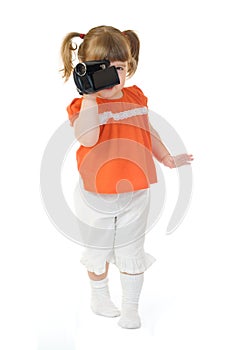 Cute little girl with camcoder photo