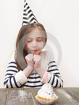 Cute little girl celebrates birthday.