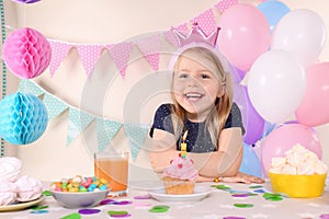 Cute little girl celebrating Birthday at home