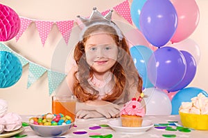 Cute little girl celebrating Birthday at home