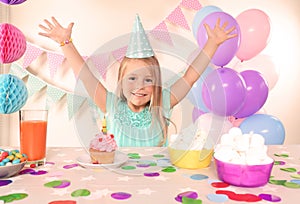 Cute little girl celebrating Birthday at home