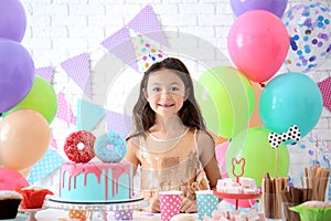 Cute little girl celebrating Birthday at home