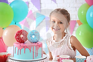 Cute little girl celebrating Birthday at home