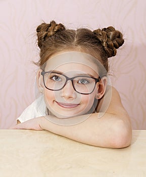 Cute little girl child preteen in eyeglasses education, school and vision concept