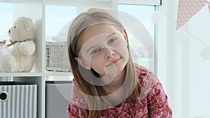 Cute little girl in children`s room