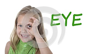 Cute little girl circling eye in body parts learning English words at school