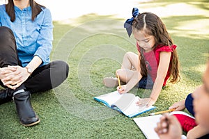 Little girl enjoying a class outdoors photo