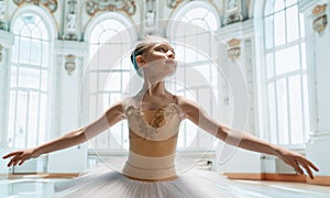 girl in a tutu dancing in the ball room photo