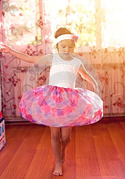 Cute little girl dreams of becoming a ballerina