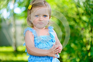 Cute little girl in dress at park