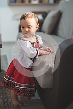 Cute little girl dressed in traditional Romanian folk costume