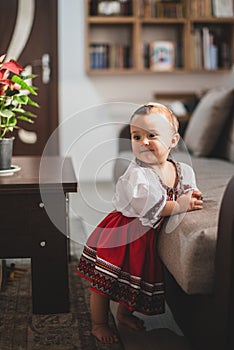 Cute little girl dressed in traditional Romanian folk costume