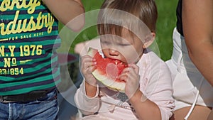 Cute Little Girl Eating Watermelon in Summer Day