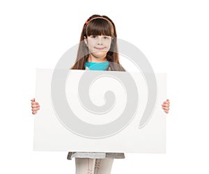Cute little girl with empty paper sheet in hands