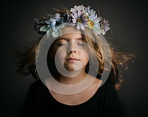 Cute little girl with flower wreath