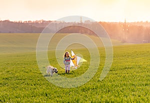 Cute little girl flying kite