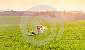 Cute little girl flying kite