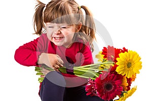 Cute little girl with gerbera flowers bouquet