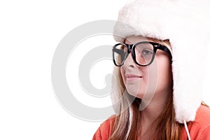 Cute little girl with glasses in warm white hat