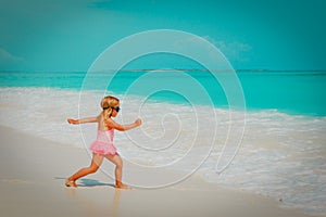 Cute little girl going to swim at beach