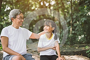 Cute little girl and grandfather