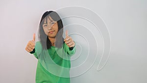 cute little girl in green t-shirt isolated on white background