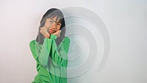 cute little girl in green t-shirt isolated on white background