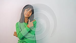 cute little girl in green t-shirt isolated on white background