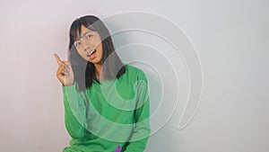 cute little girl in green t-shirt  on white background