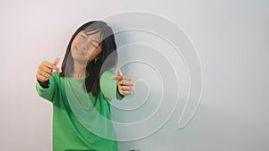 cute little girl in green t-shirt  on white background