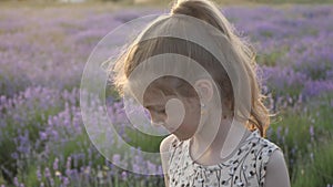 Cute little girl happily plays in Provence. merriment and smiles feeling good summertime nature of France concept of travel