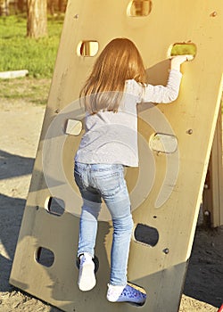 Cute Little girl has a fun outdoors. Happy childhood concept.