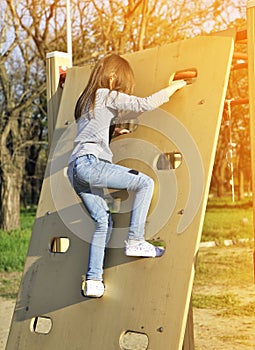 Cute Little girl has a fun outdoors. Happy childhood concept.