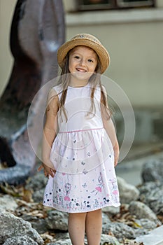 Cute little girl with hat, smilling