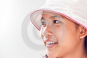 Cute little girl with hat studio portrait. Isolated over white.